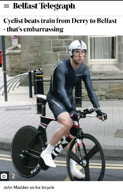 Cyclist racing the train from Derry to Belfast